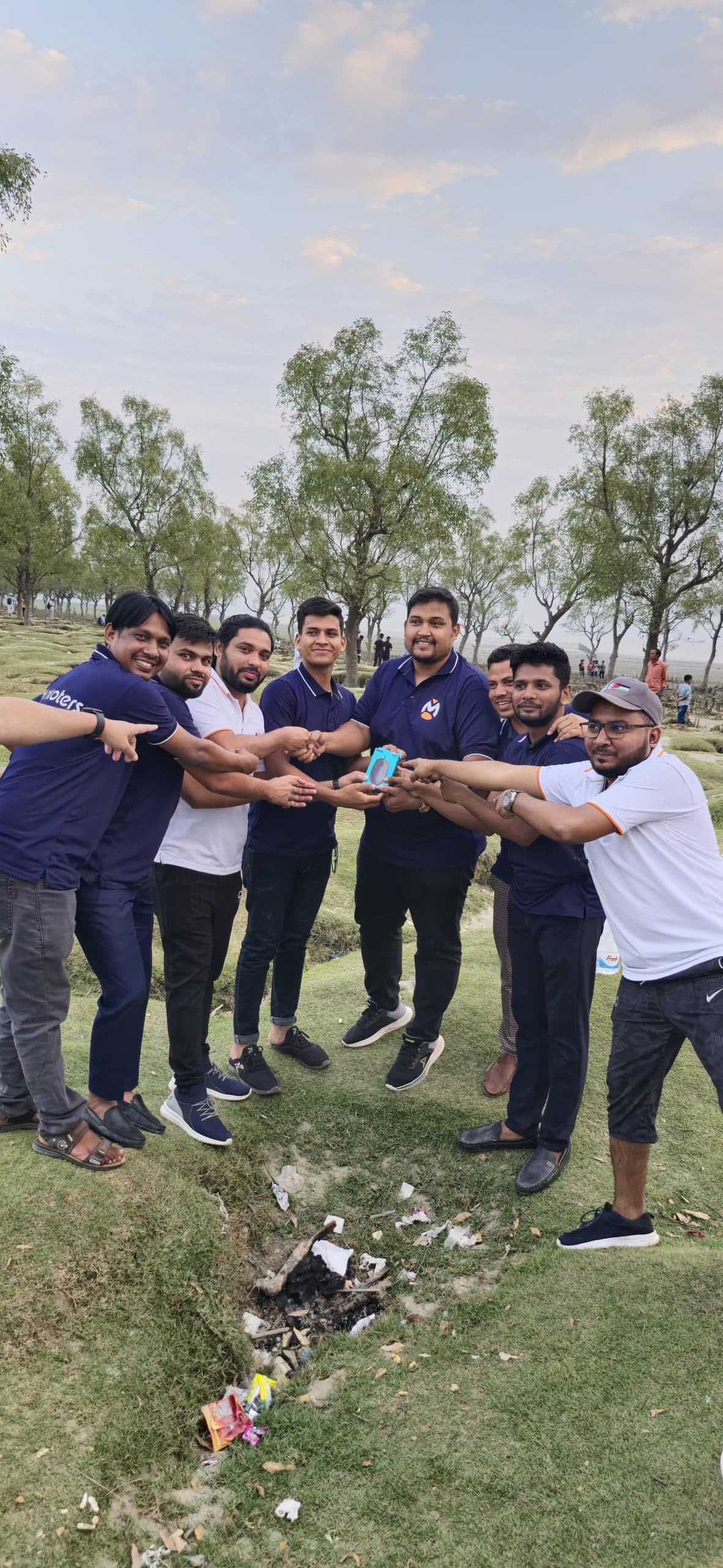 Team celebrating a major milestone with cake and decorations